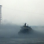 The M/V MSC Sabrina shrouded in mist as it is stuck in the St. Lawrence's shallow waters near Trois-Rivières .