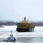 Tugboats make their way to the M/V MSC Sabrina in an attempt to rescue it from the hard clay and ice of the St. Lawrence River.