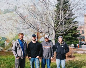 The TRG team poses outside in Bozeman during No-Shave November.