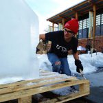 Johnny Certo represents for the TRG Team as he carves ice during a Sweet Pea event in Bozeman, Montana.