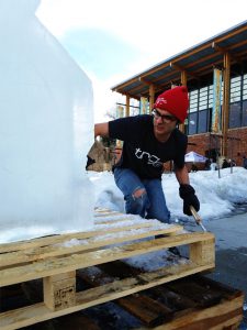Johnny Certo represents for the TRG Team as he carves ice during a Sweet Pea event in Bozeman, Montana.