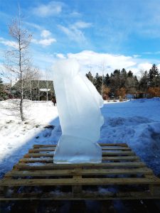 The TRG Team carves an Easter Island Head Statue, a Moai, at the Sweet Pea Ice Carving event in Bozeman, Montana.