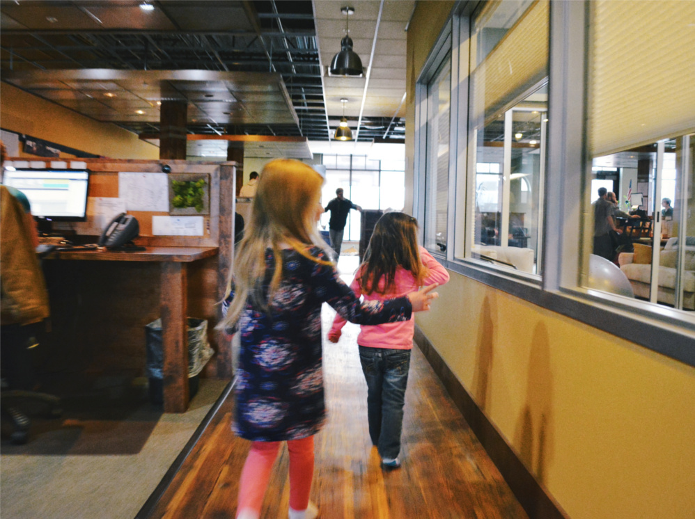 The kids take over Trade Risk Guaranty's downtown Bozeman office.
