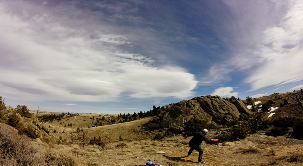 Craig Sward plays frisbee golf on Sward ranch outside of Bozeman, Montana.